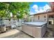 Backyard patio features a luxurious hot tub, perfect for relaxation and entertaining guests at 10407 Oleander Dr, Port Richey, FL 34668