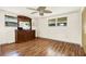 Bright bedroom with laminate floors and large windows at 10407 Oleander Dr, Port Richey, FL 34668