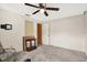 Bedroom with ceiling fan and carpet at 10407 Oleander Dr, Port Richey, FL 34668