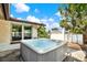 Backyard patio features a luxurious hot tub with clear blue water, perfect for relaxation and entertaining guests at 10407 Oleander Dr, Port Richey, FL 34668