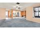 Bright living room view of the kitchen area and access to other rooms in the home at 10407 Oleander Dr, Port Richey, FL 34668