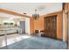 Living room area with view of kitchen and vintage china cabinet at 10407 Oleander Dr, Port Richey, FL 34668
