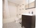 This bathroom features a shower-tub combo and striking tilework at 120 S Church Ave # 202, Tampa, FL 33609