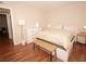 Cozy bedroom with laminate flooring and neutral paint at 120 S Church Ave # 202, Tampa, FL 33609