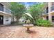 Charming courtyard showcasing a fountain, brick-paved ground, and lush greenery at 120 S Church Ave # 202, Tampa, FL 33609