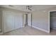 Bedroom showcasing wood floors, a paneled closet and an en suite bathroom at 12372 113Th St, Largo, FL 33778