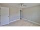 Bedroom with light wood flooring, base molding and neutral paint at 12372 113Th St, Largo, FL 33778