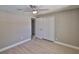 A bedroom showcasing a spacious closet with doors, modern lighting and wood style flooring at 12372 113Th St, Largo, FL 33778
