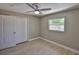Bedroom features a closet with paneled doors, a window, and light wood-style flooring at 12372 113Th St, Largo, FL 33778