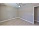 This bedroom features sleek wood flooring and a modern ceiling fan with decorative medallion at 12372 113Th St, Largo, FL 33778