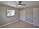 Bedroom with light wood flooring, neutral walls, closet with paneled doors and a window with natural light at 12372 113Th St, Largo, FL 33778