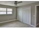 Bedroom with a closet, light wood floors and a window at 12372 113Th St, Largo, FL 33778