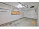 An empty garage with a window and a white door at 12372 113Th St, Largo, FL 33778