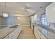 Bright kitchen featuring granite countertops, stainless steel appliances and light wood flooring at 12372 113Th St, Largo, FL 33778