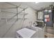 Laundry room with washer, dryer and storage shelves at 12372 113Th St, Largo, FL 33778