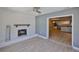 Living room showcasing a fireplace and view into the open kitchen at 12372 113Th St, Largo, FL 33778