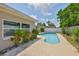 A backyard swimming pool provides the home with an outdoor escape and privacy at 12372 113Th St, Largo, FL 33778