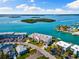 Stunning aerial perspective of a condo community with waterways and convenient marina access at 12525 3Rd E St # 303, Treasure Island, FL 33706