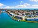 Scenic aerial view of waterfront condo highlighting boat docks, beautiful blue water, and coastal living at 12525 3Rd E St # 303, Treasure Island, FL 33706