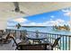 Outdoor balcony with seating and spectacular views of the water and natural landscape at 12525 3Rd E St # 303, Treasure Island, FL 33706