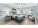 Cozy bedroom features a comfortable bed, soft lighting, and charming decor to create a relaxing space at 12525 3Rd E St # 303, Treasure Island, FL 33706