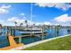 Waterfront dock with boat lift, perfect for boating enthusiasts seeking easy access to the water at 12525 3Rd E St # 303, Treasure Island, FL 33706