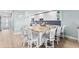 Bright kitchen features granite countertops, white cabinets, and a spacious island with seating at 12525 3Rd E St # 303, Treasure Island, FL 33706