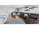 Open concept view from the living room into a white kitchen with stainless appliances at 12525 3Rd E St # 303, Treasure Island, FL 33706