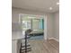Open kitchen with a view into the bright bedroom at 1281 Robin Hood Ln, Dunedin, FL 34698