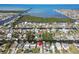 Aerial view of waterfront community highlighting waterfront access, residential properties, and lush landscapes at 13323 Susan Dr, Hudson, FL 34667