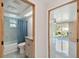 Well-lit bathroom featuring a shower-tub combination and a granite-topped vanity at 13323 Susan Dr, Hudson, FL 34667