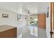 Spacious bedroom with a ceiling fan, sliding glass doors to the backyard, and an ensuite bathroom at 13323 Susan Dr, Hudson, FL 34667