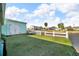 Home backyard featuring a canal view, a storage shed, and grassy area at 13929 Muriel Ave, Hudson, FL 34667