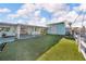 Backyard featuring a covered patio and canal access at 13929 Muriel Ave, Hudson, FL 34667