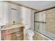 Vintage bathroom includes a walk-in shower, toilet, and vanity at 13929 Muriel Ave, Hudson, FL 34667