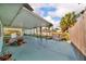 A covered patio featuring an outdoor bar area, perfect for entertaining at 13929 Muriel Ave, Hudson, FL 34667