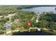 Breathtaking lakefront property nestled among lush trees with private dock access and serene water views at 14449 Wadsworth Dr, Odessa, FL 33556