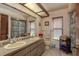 Bathroom with double vanity, large mirror, toilet, and shower at 14449 Wadsworth Dr, Odessa, FL 33556