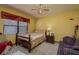 Bedroom featuring a ceiling fan, window, and natural light at 14449 Wadsworth Dr, Odessa, FL 33556