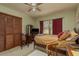 Comfortable bedroom with a cozy decor, closet, and natural light at 14449 Wadsworth Dr, Odessa, FL 33556