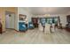 Open-concept living and dining area filled with natural light, wood floors, and comfortable seating at 14449 Wadsworth Dr, Odessa, FL 33556