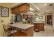 Large kitchen with island and breakfast bar featuring granite countertops, stainless steel appliances, and cabinetry at 14449 Wadsworth Dr, Odessa, FL 33556
