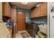 Well-equipped laundry room with modern appliances and ample storage space at 14449 Wadsworth Dr, Odessa, FL 33556