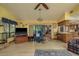 Inviting living room featuring wood floors, comfortable seating, and sliding glass doors to the outdoors at 14449 Wadsworth Dr, Odessa, FL 33556