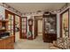 Inviting living room featuring wood accents, vintage furnishings and multiple entryways at 14449 Wadsworth Dr, Odessa, FL 33556