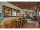 Entertainer's patio includes a pass-through bar and views of the lake from the seating area at 14449 Wadsworth Dr, Odessa, FL 33556