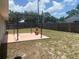 Spacious backyard with a pergola, chiminea, and wood fence, perfect for outdoor entertaining at 1602 Taylor Lake Cir, Largo, FL 33778