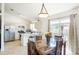 Inviting dining area with kitchen featuring stainless steel appliances and barstool seating at 1602 Taylor Lake Cir, Largo, FL 33778
