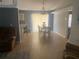 Combination dining and living area features tile flooring and natural light at 1602 Taylor Lake Cir, Largo, FL 33778