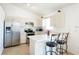 Bright kitchen with stainless steel appliances and barstool seating at 1602 Taylor Lake Cir, Largo, FL 33778
